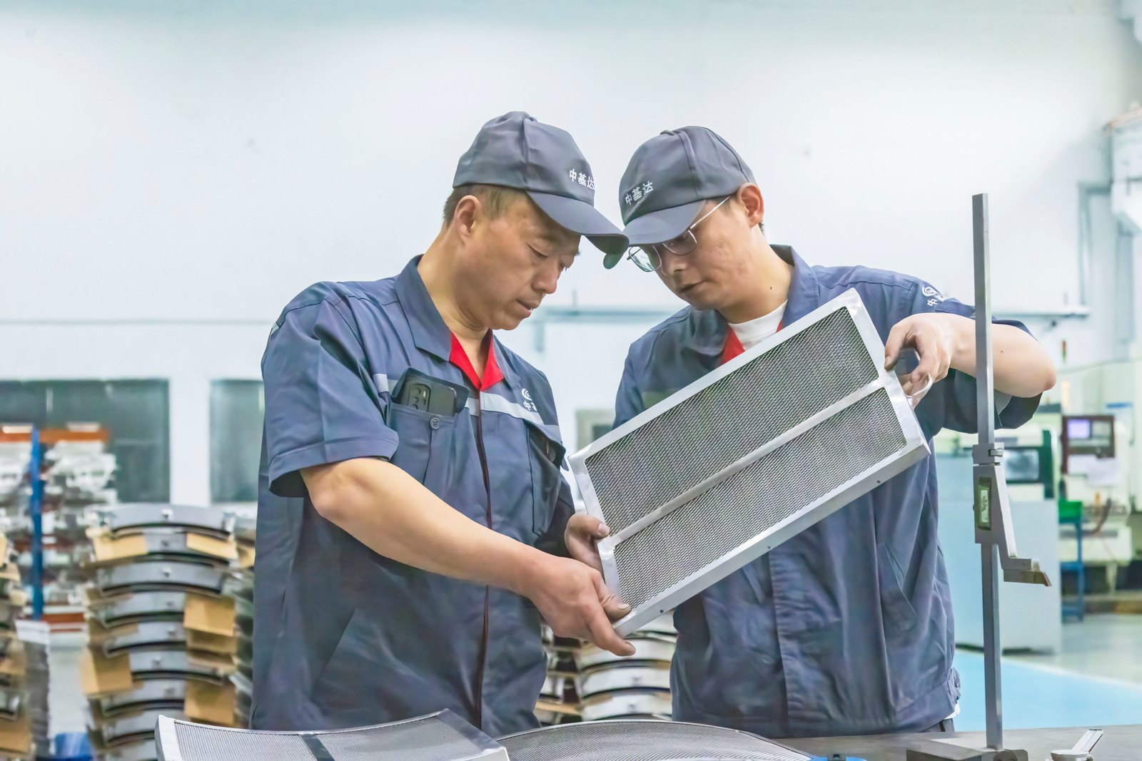 Factory team checking a fabricated assembly